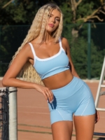 Син спортен комплект клин и бюстие с бели шевове